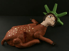 deer Crude ceramic sculpture of the Statue of Liberty as a deer with a gash in their side.